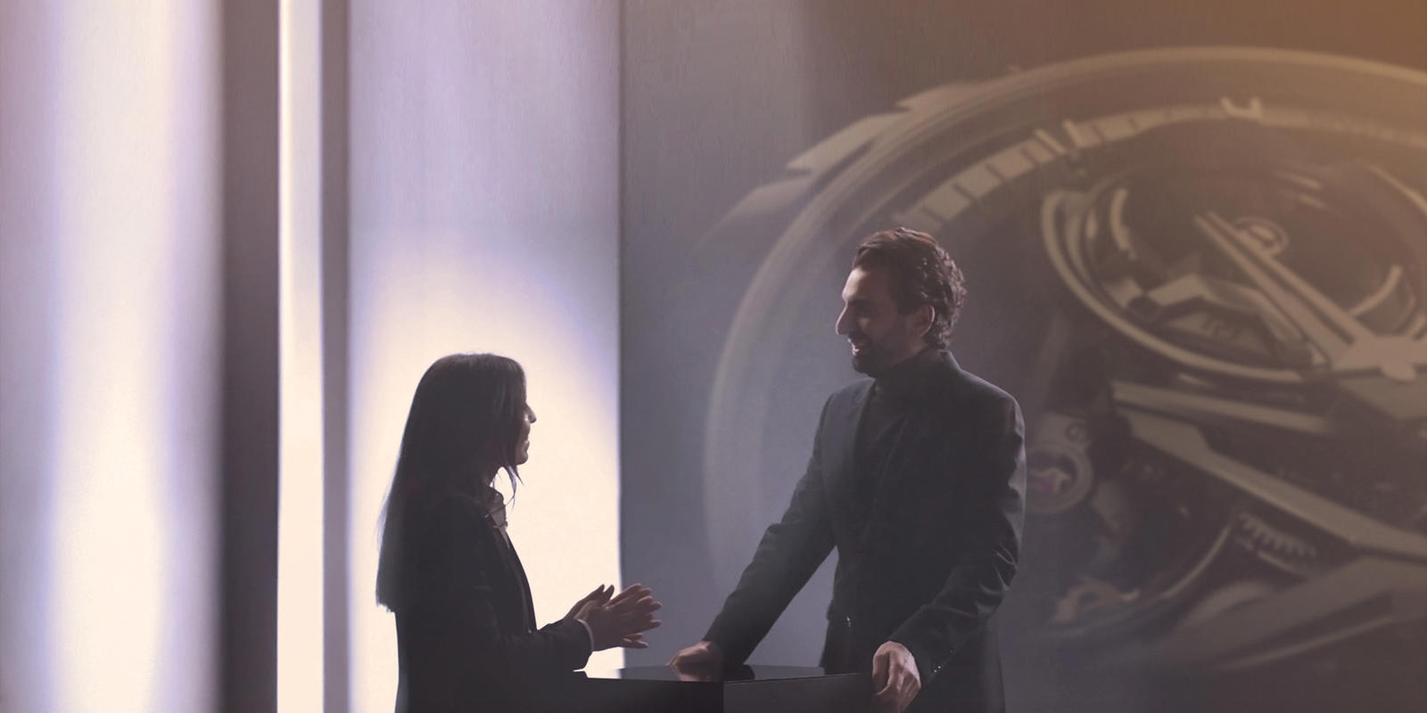 a person and person standing next to each other