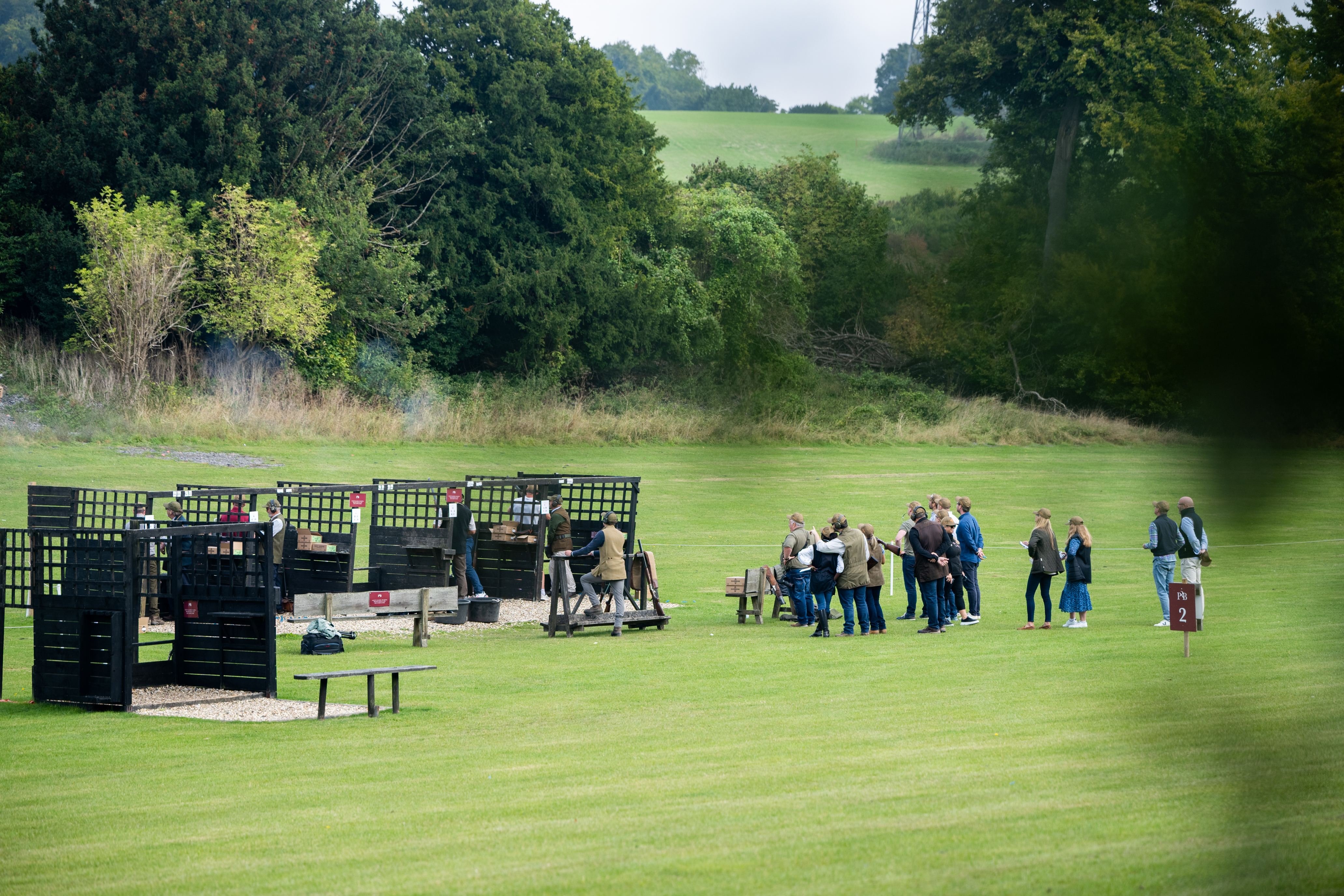 a group of people standing in a field