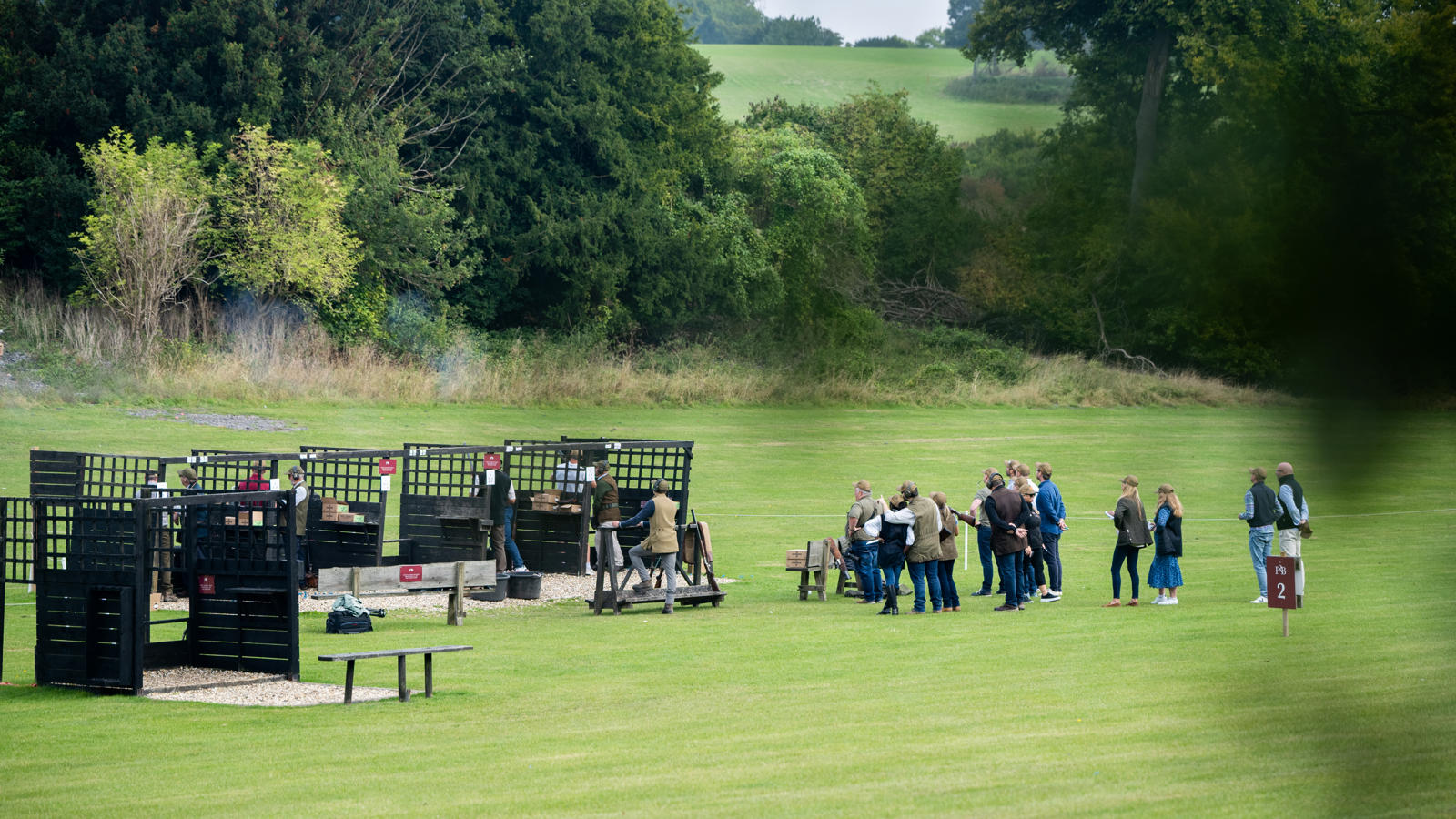 a group of people standing in a field