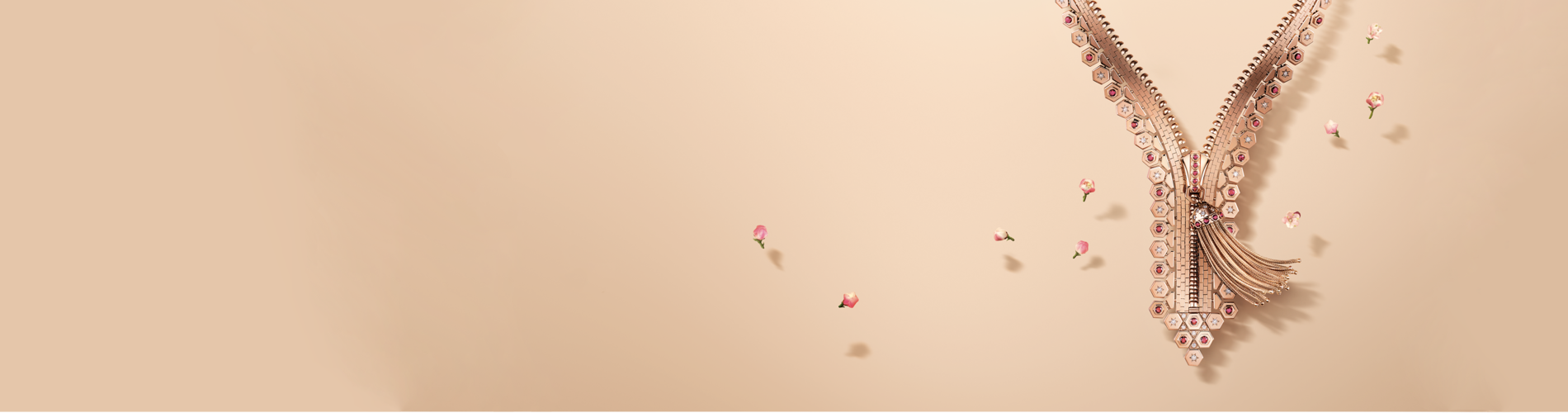 une fleur rose sur une surface blanche