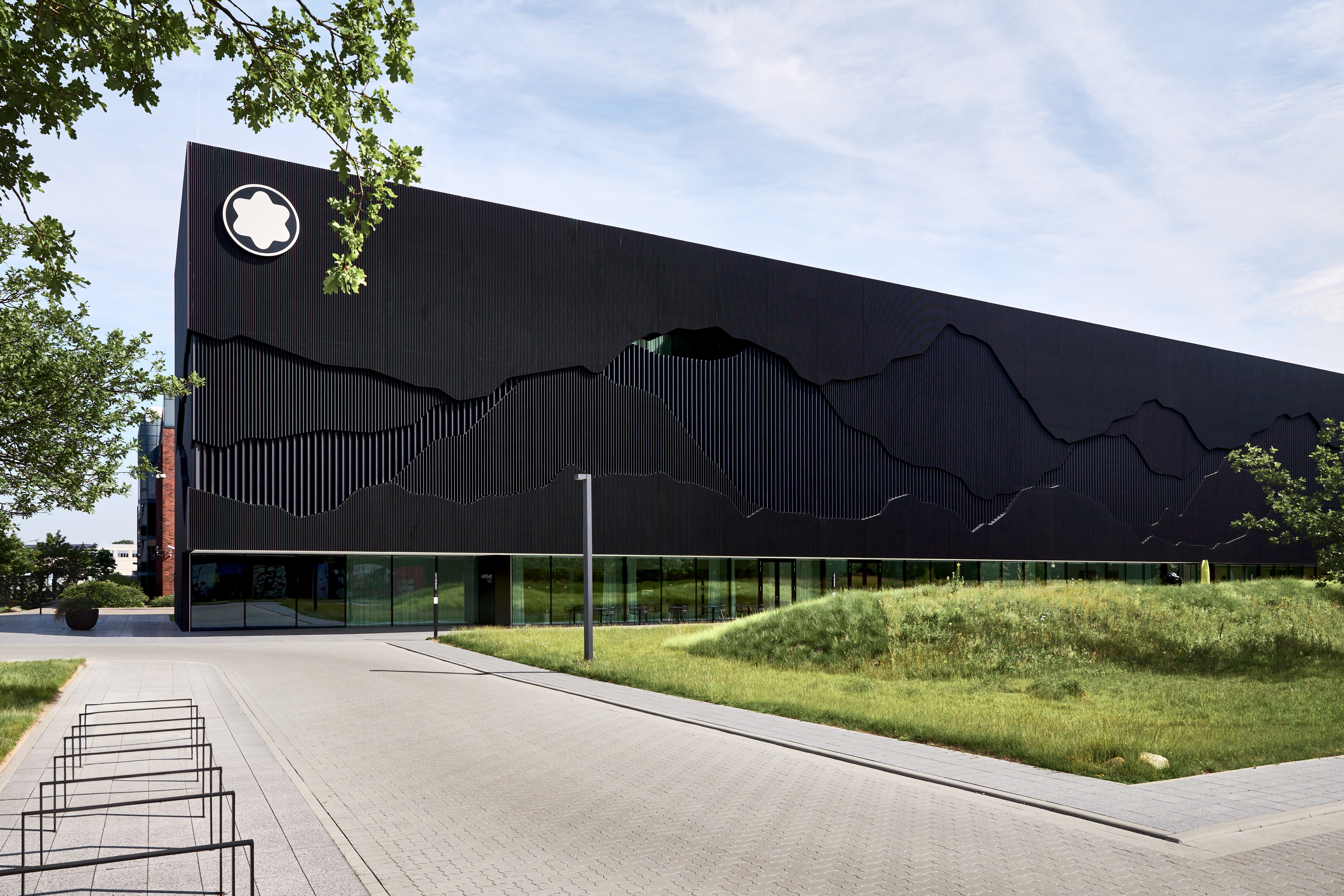 a black building with a white logo on the side