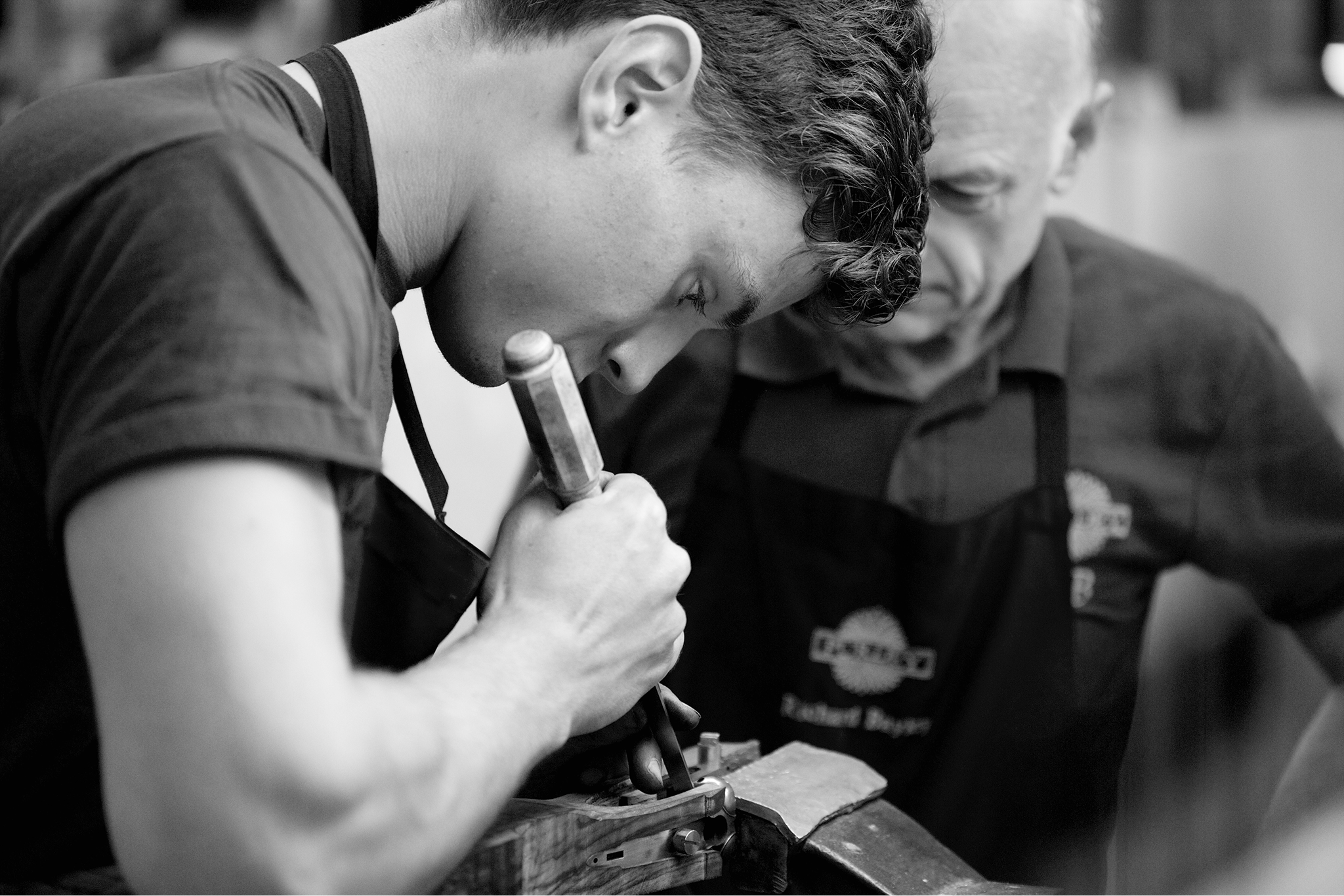 a person working on a piece of metal