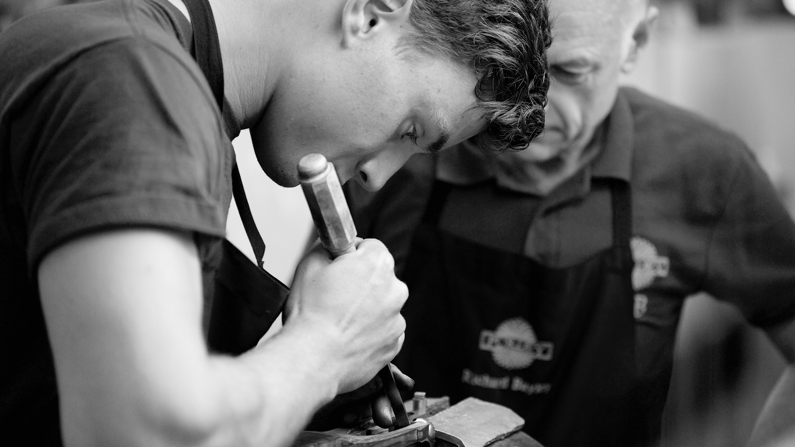 a person working on a piece of metal