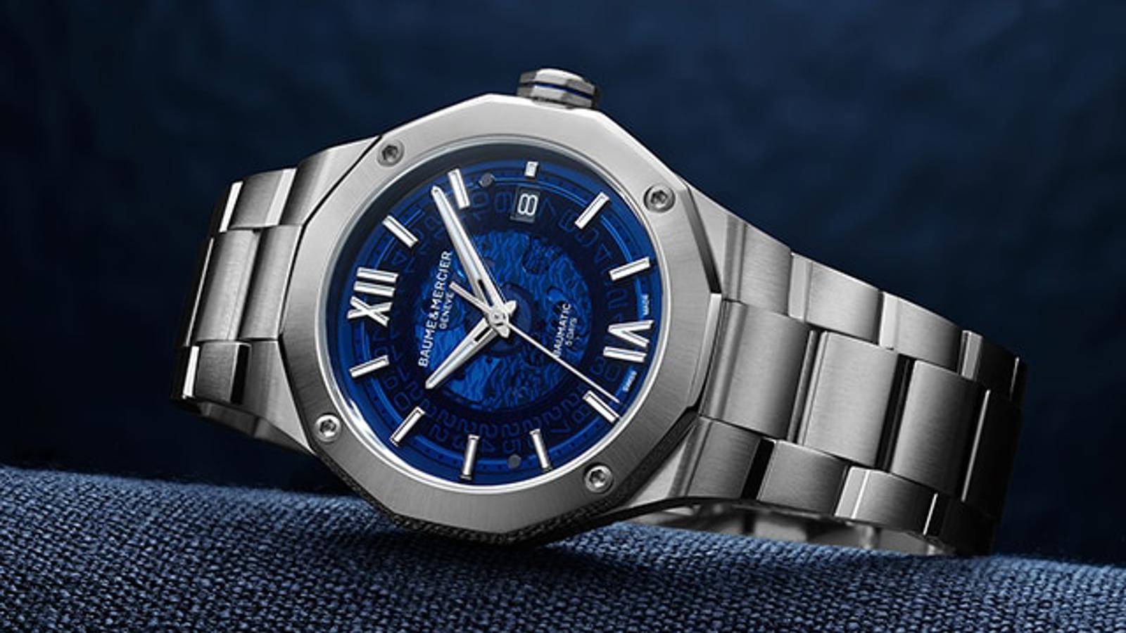 a silver watch with blue face