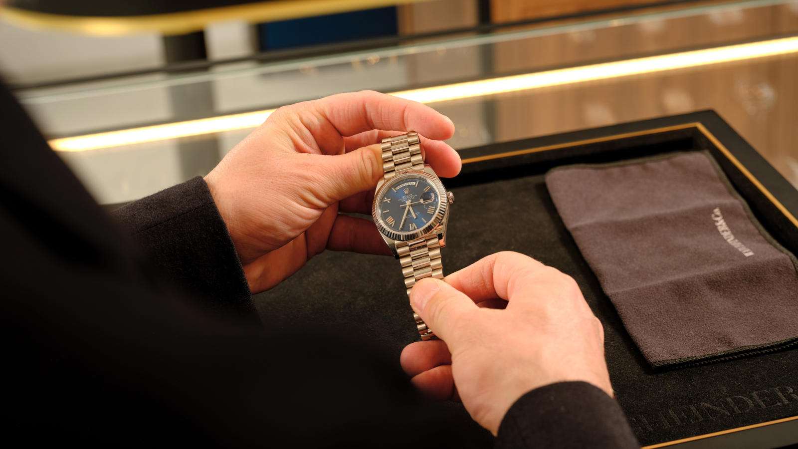 a person holding a watch