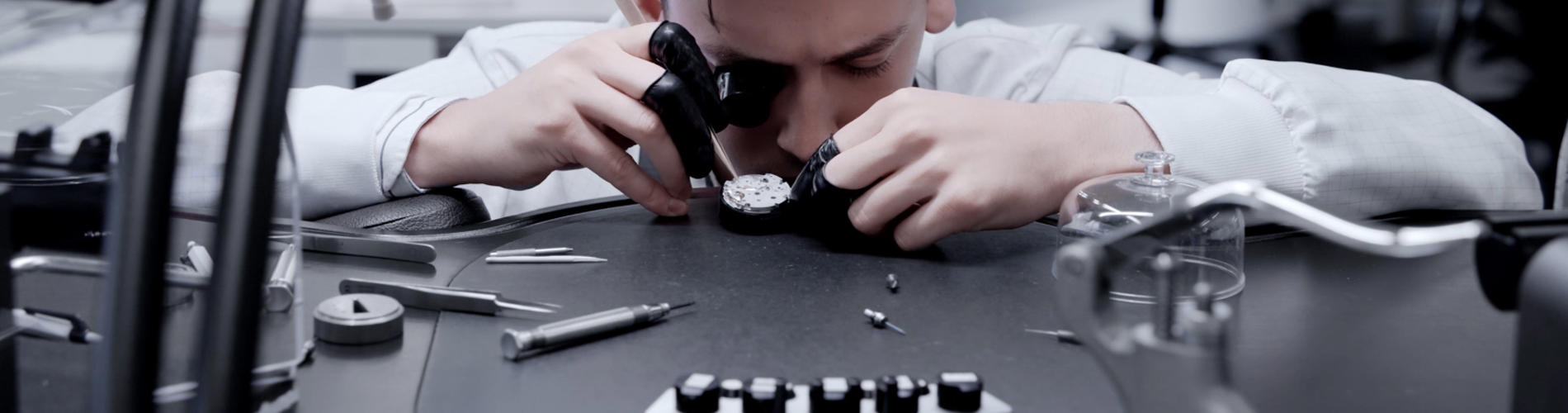 a person looking through a microscope